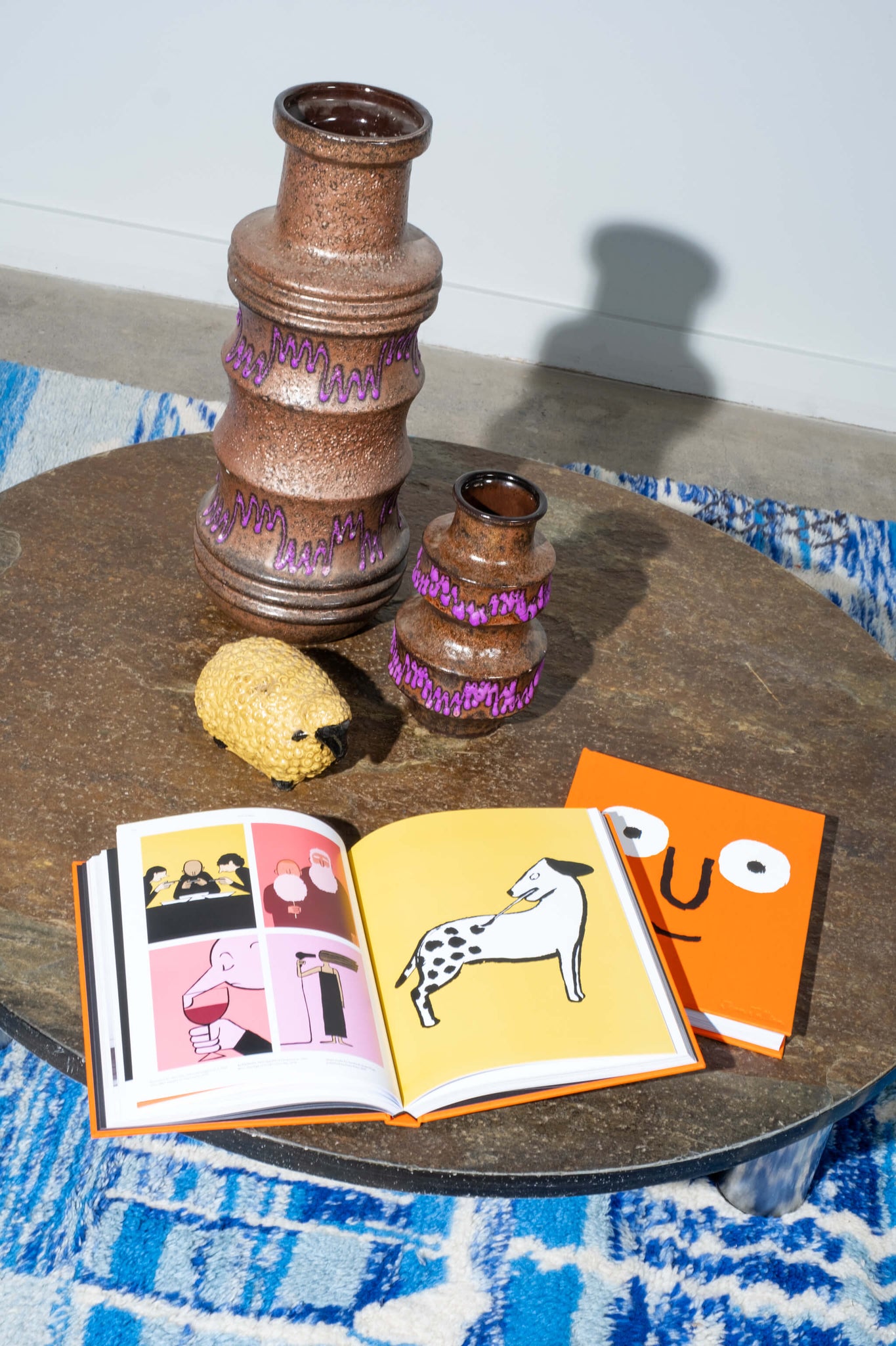 Vintage Brown & Purple Mid-Century Volcanic Vase, Large, shown with small vase on a coffee table with a rug and open books