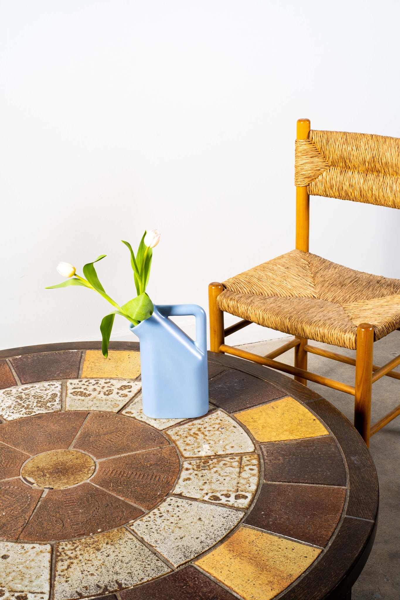 Vintage 1970s Tiled Top Coffee Table Tue Poulsen Haslev, shown with wood and jute chair ad a blue vase with tulips
