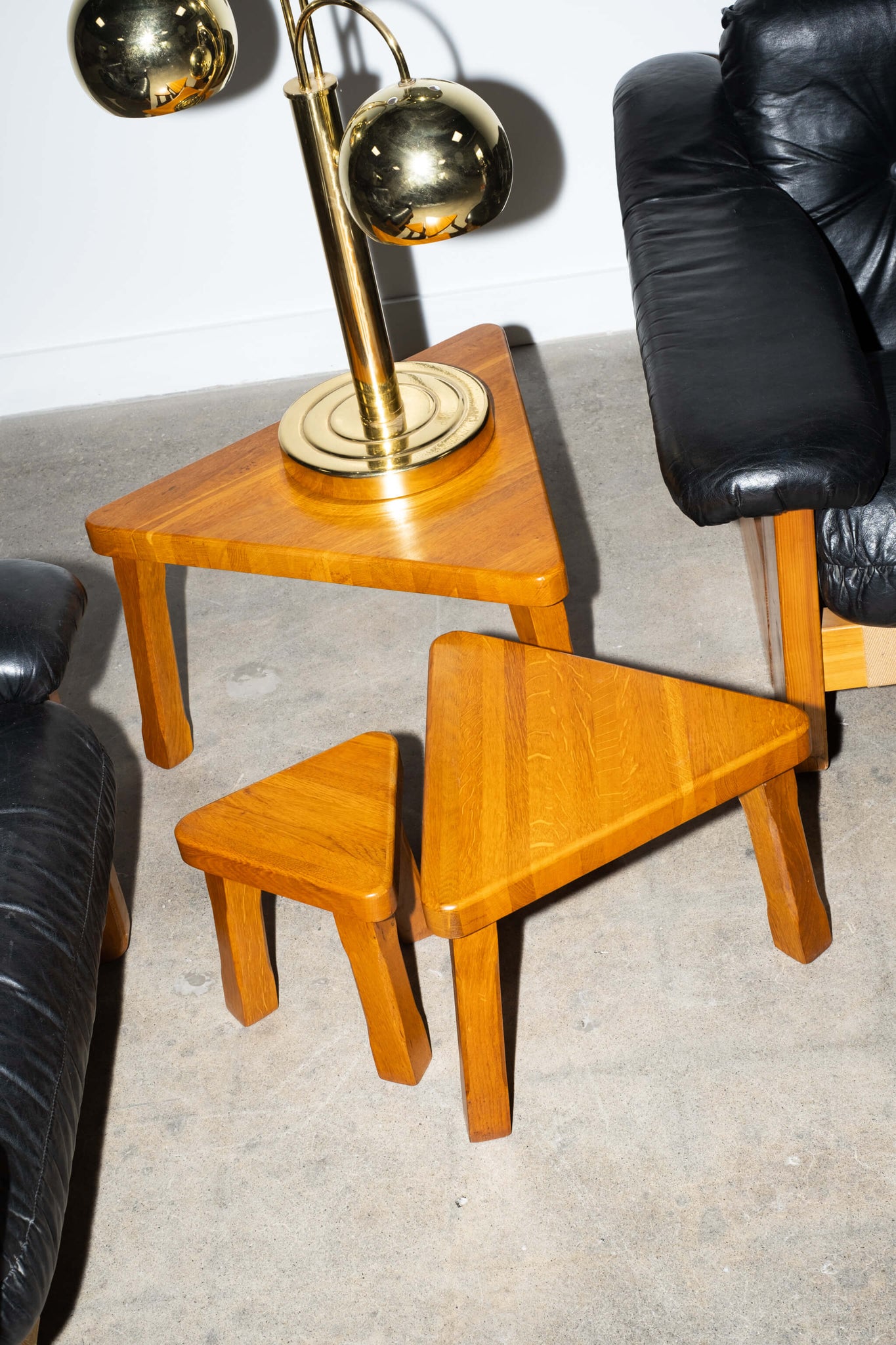 Vintage Set of 3 Brutalist Oak Nesting Tables in the Manner of Pierre Chapo, shown with lamp and leather arm chairs