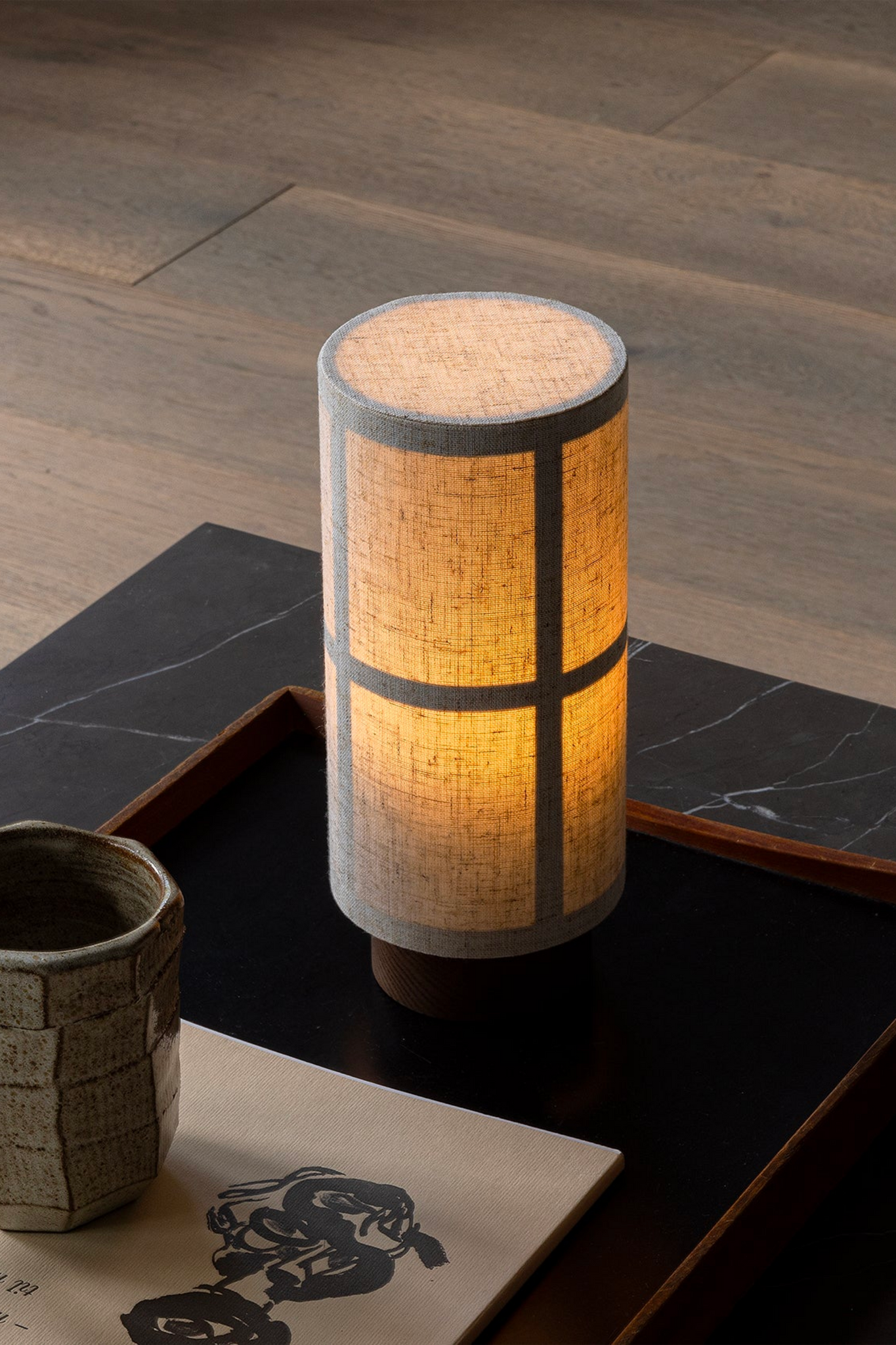 Raw Hashira Portable Table Lamp by Menu, lit up