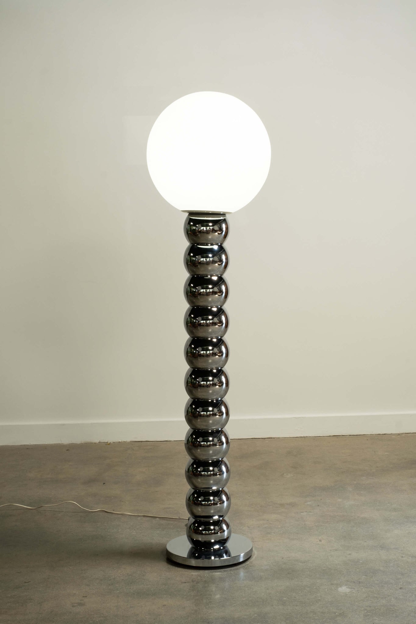 Vintage 1960s Chrome Stacked Ball Floor Lamp, front view and lit