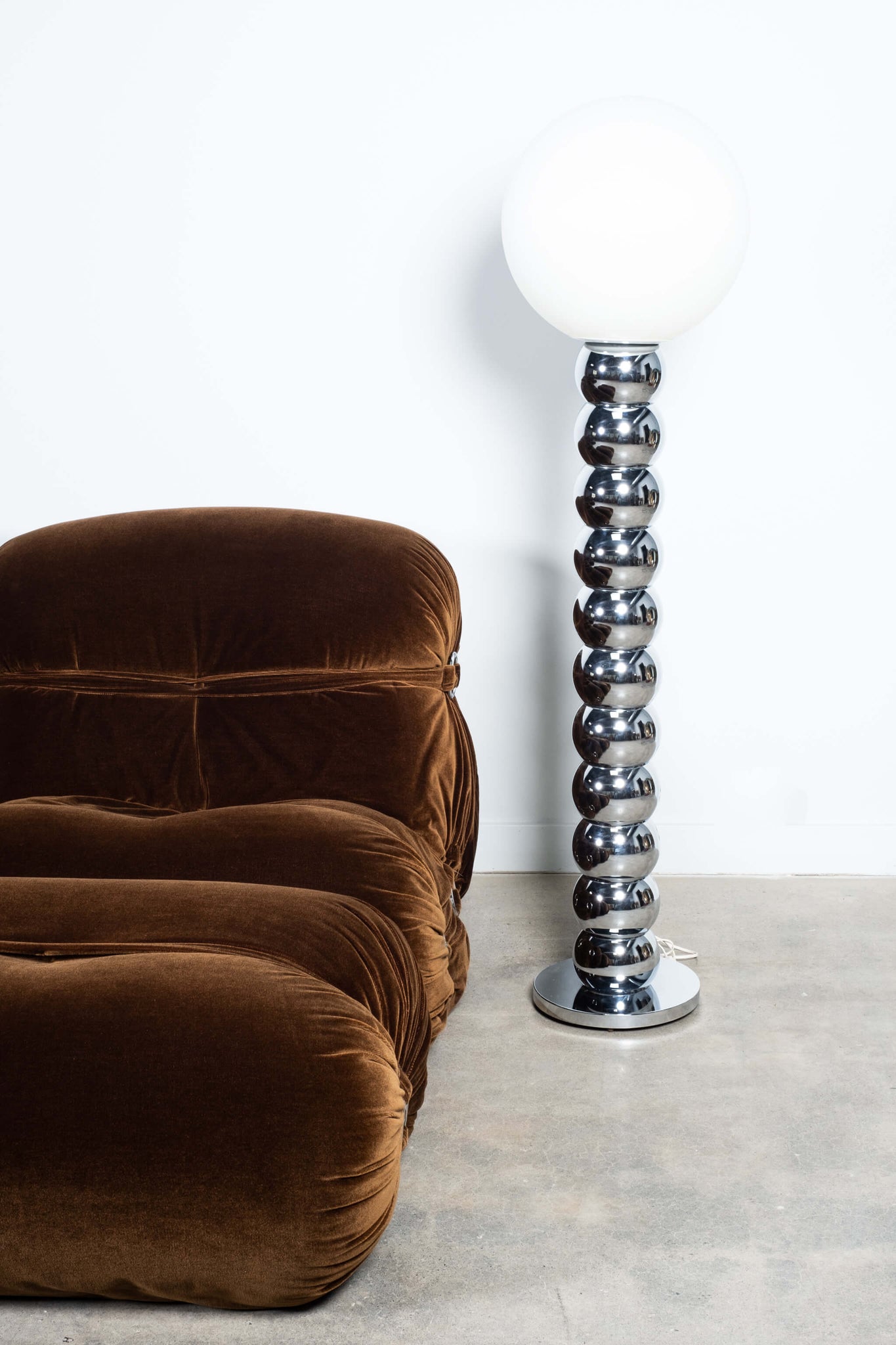 Vintage 1960s Chrome Stacked Ball Floor Lamp, shown with brown velvet lounge chair and ottoman