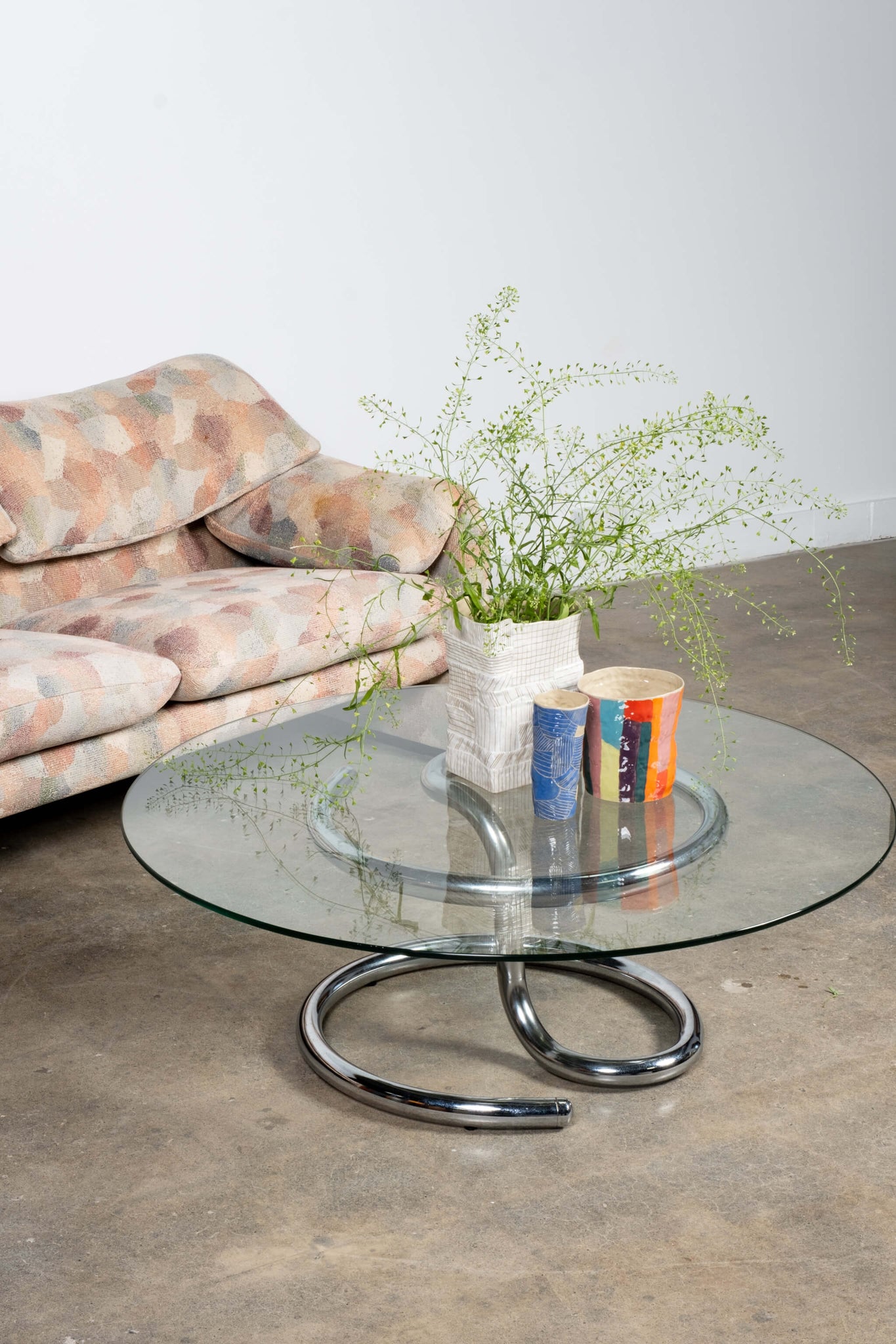 Vintage Anaconda Chrome and Glass Coffee Table 1970s Paul Tuttle, shown with couch and vases on top of the table