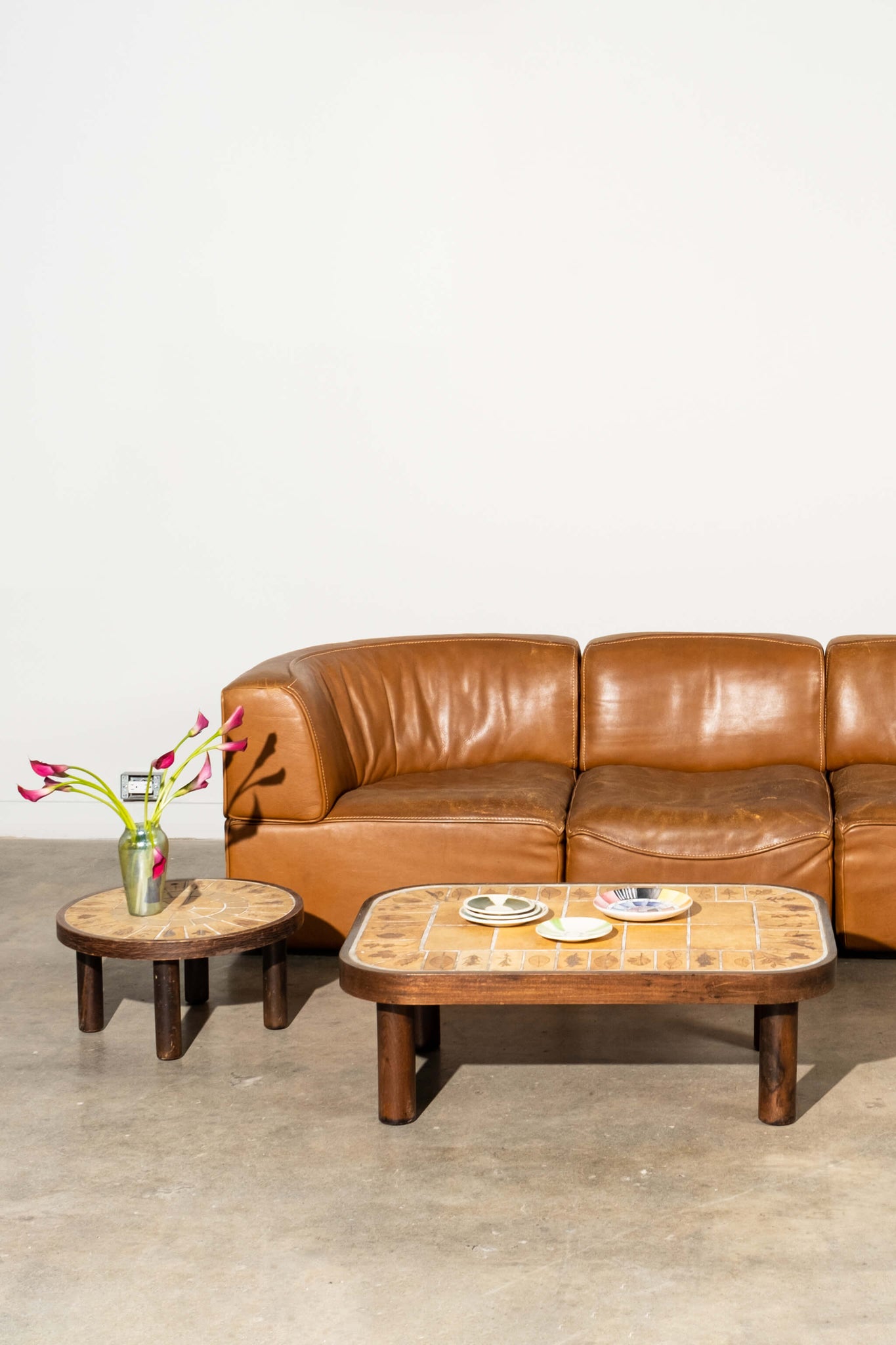 Vintage De Sede 1970s Modular 3-Seater in Patinated Brown Cognac Leather, shown with coffee and side table