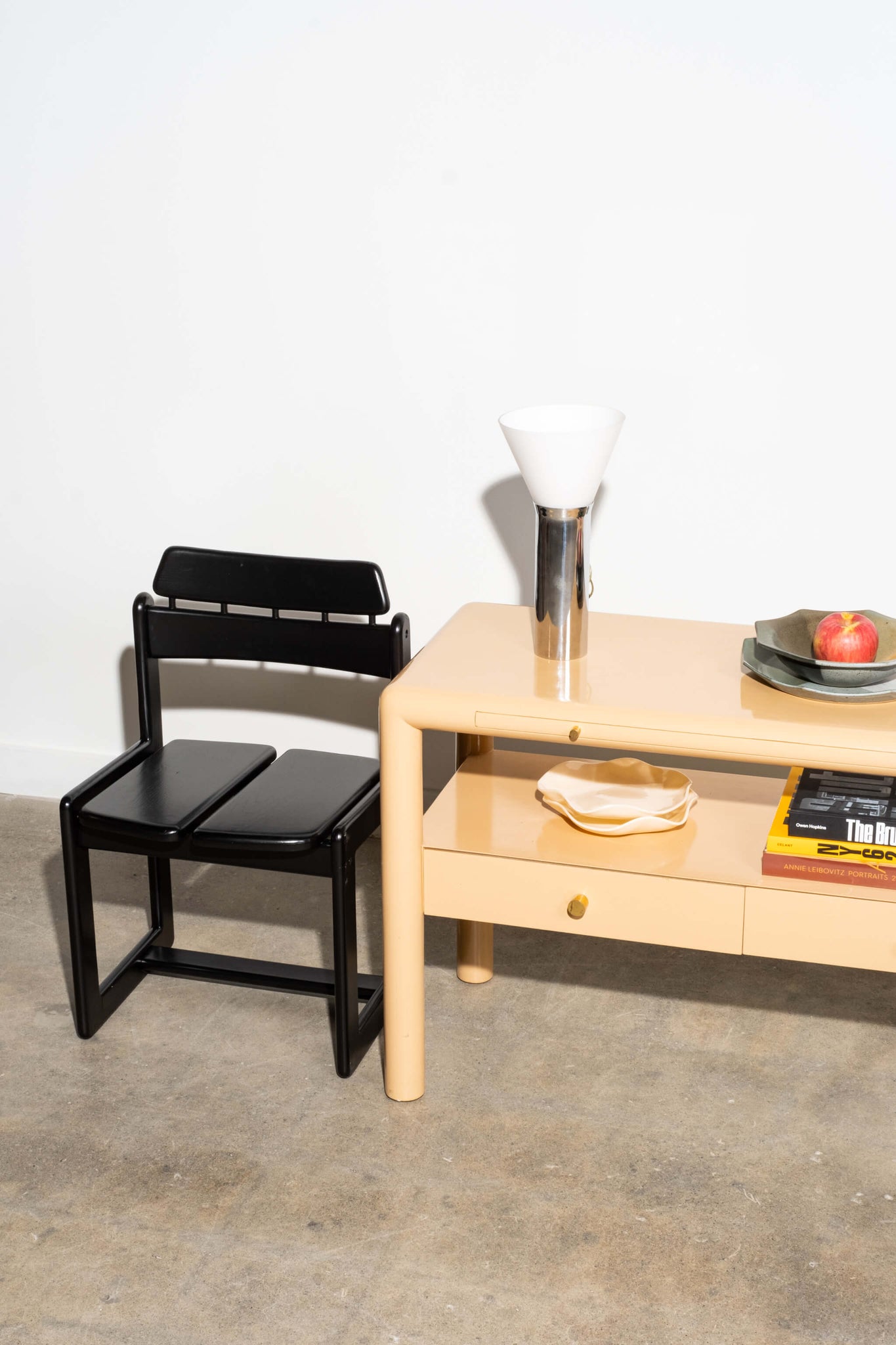 Vintage Mid-Century Chrome Table Lamp with Glass Shade, shown on shelving unit with black chair