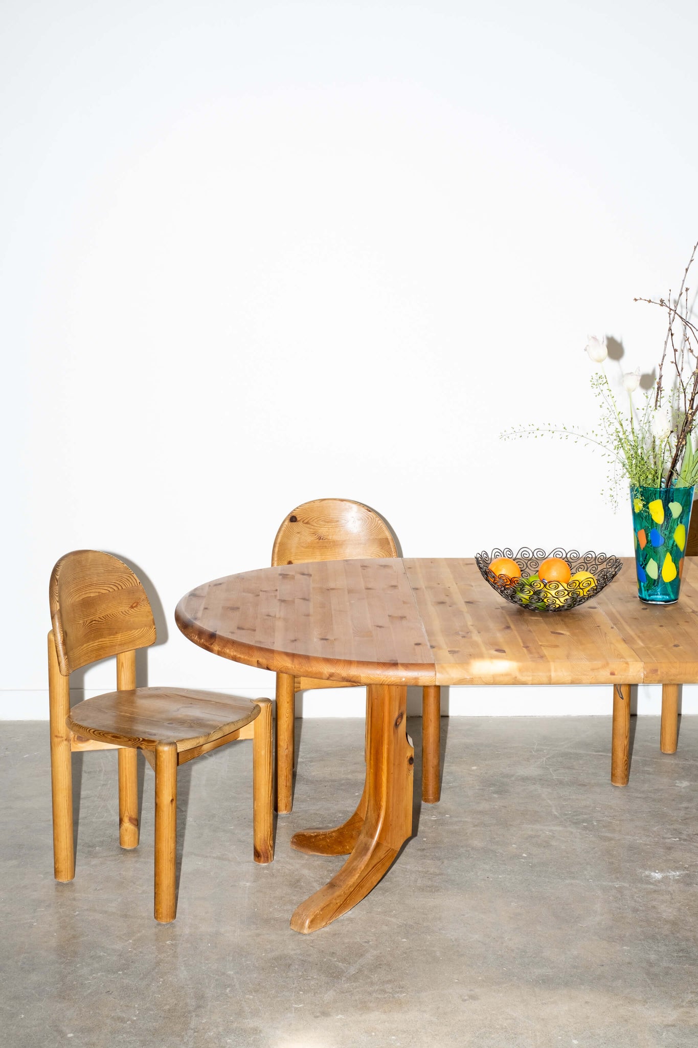 Vintage 1970s Solid Pine Extendable Dining Table, shown with 2 leaves dining chairs and tableware