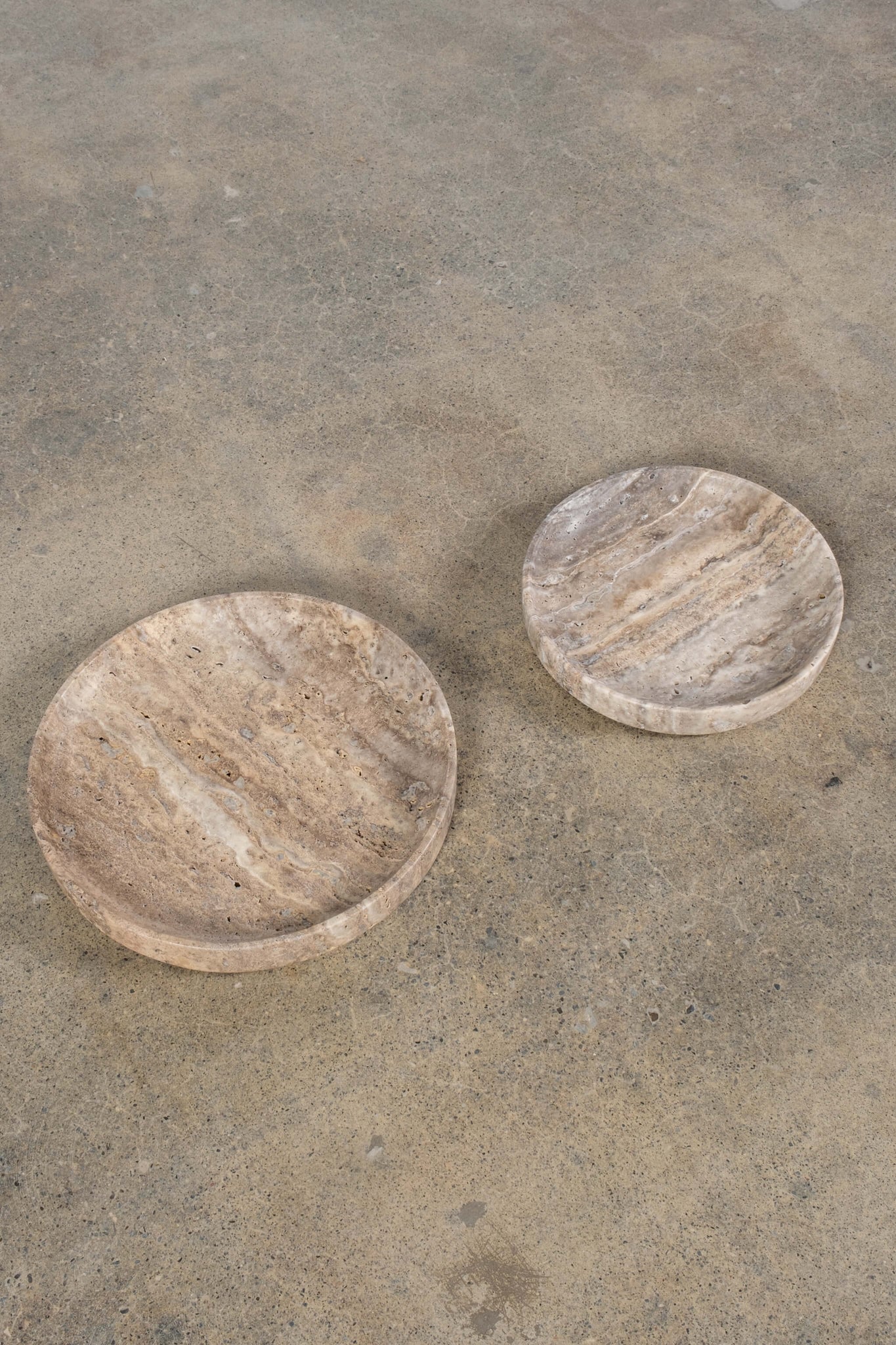 Large Catchall in Grey Travertine, shown with a small catchall