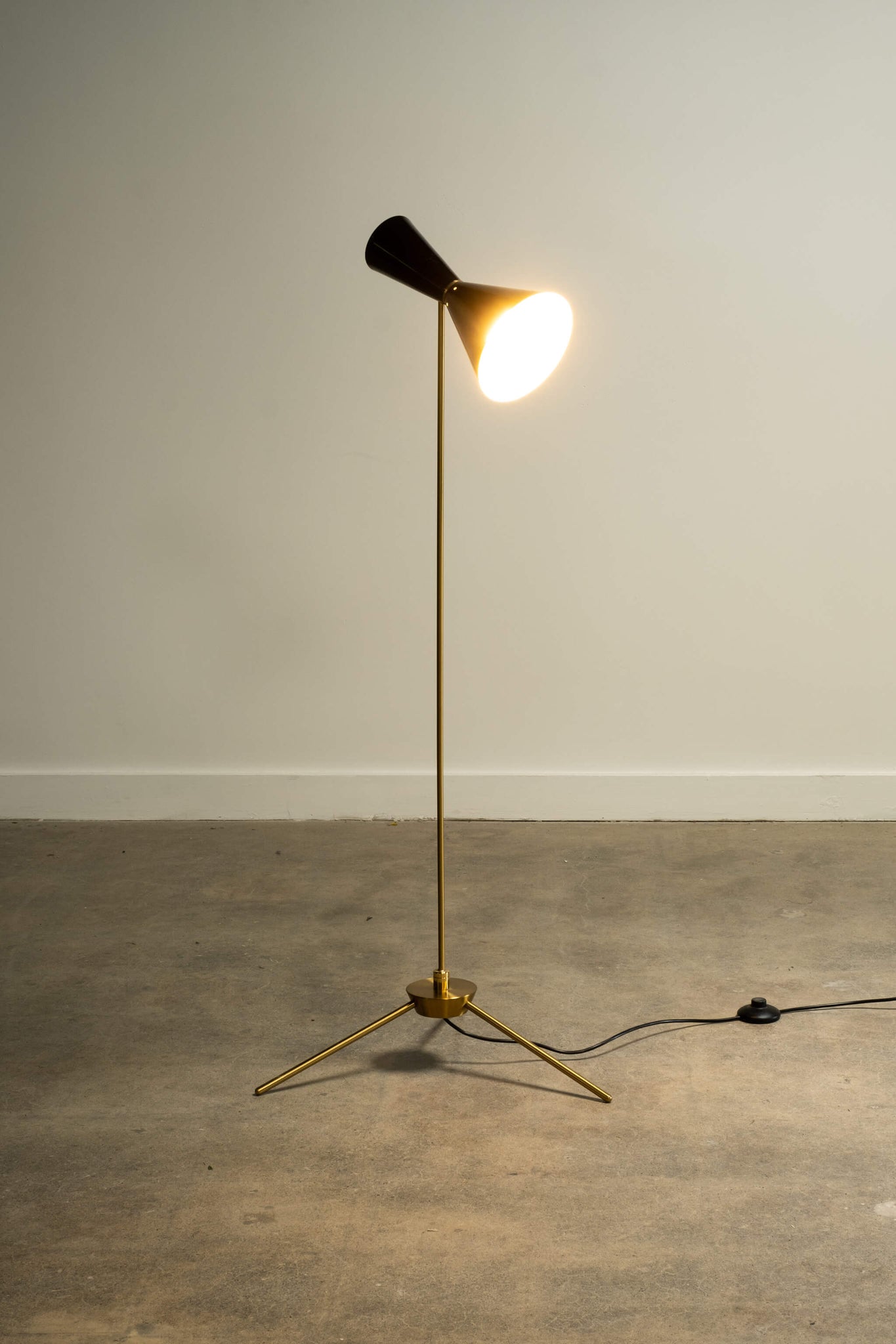 Vintage Mid Century Tilting Tripod Floor Lamp, lamp light on