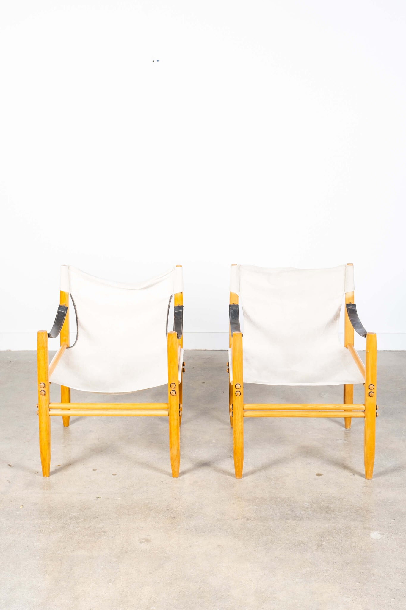 Vintage Oasi 85 Safari Chairs in White Fabric & Light Wood, shown side by side, front view