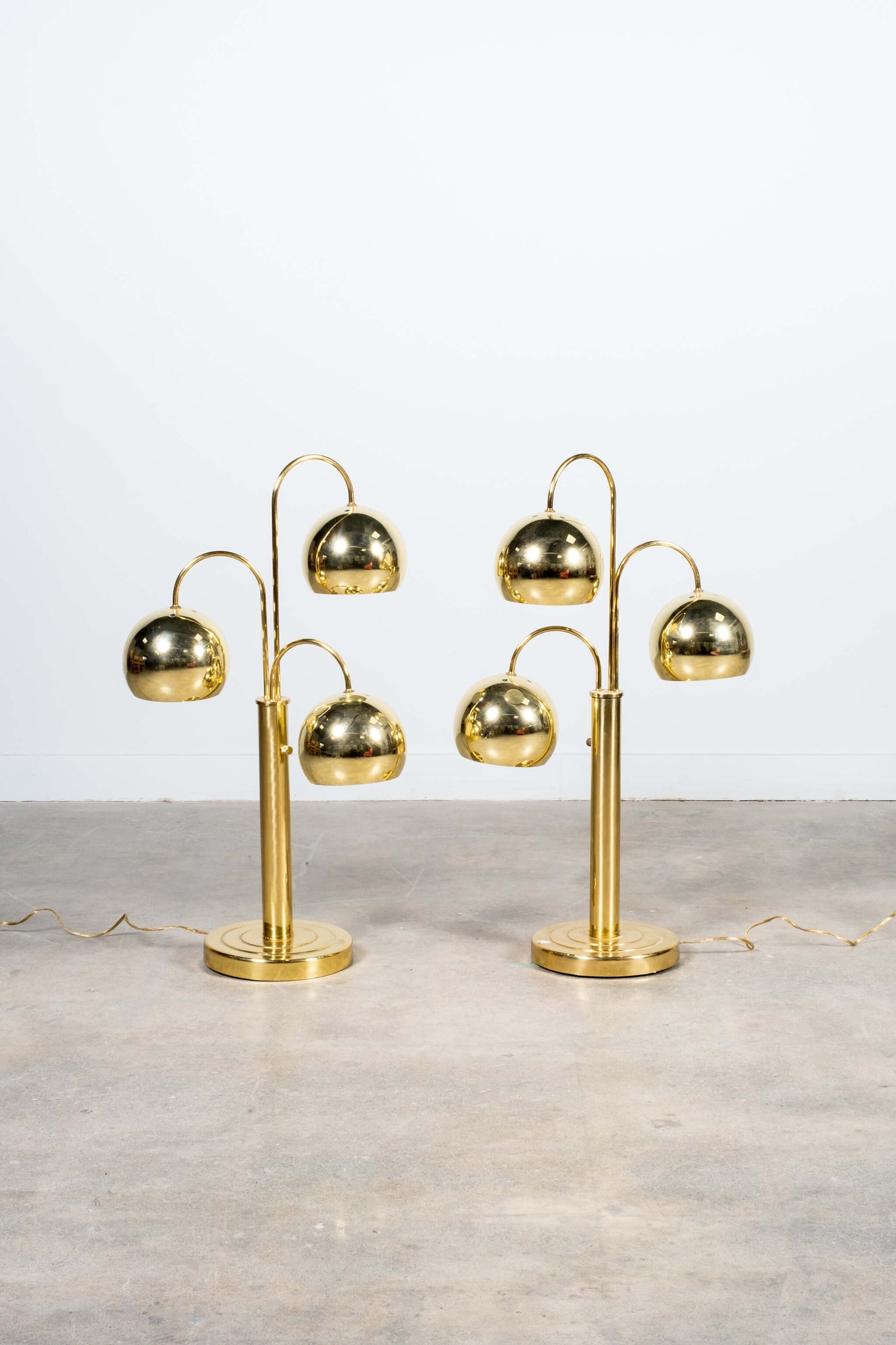 Pair of Vintage Brass Ball Eyeball Table Lamps by Robert Sonneman, shown side by side