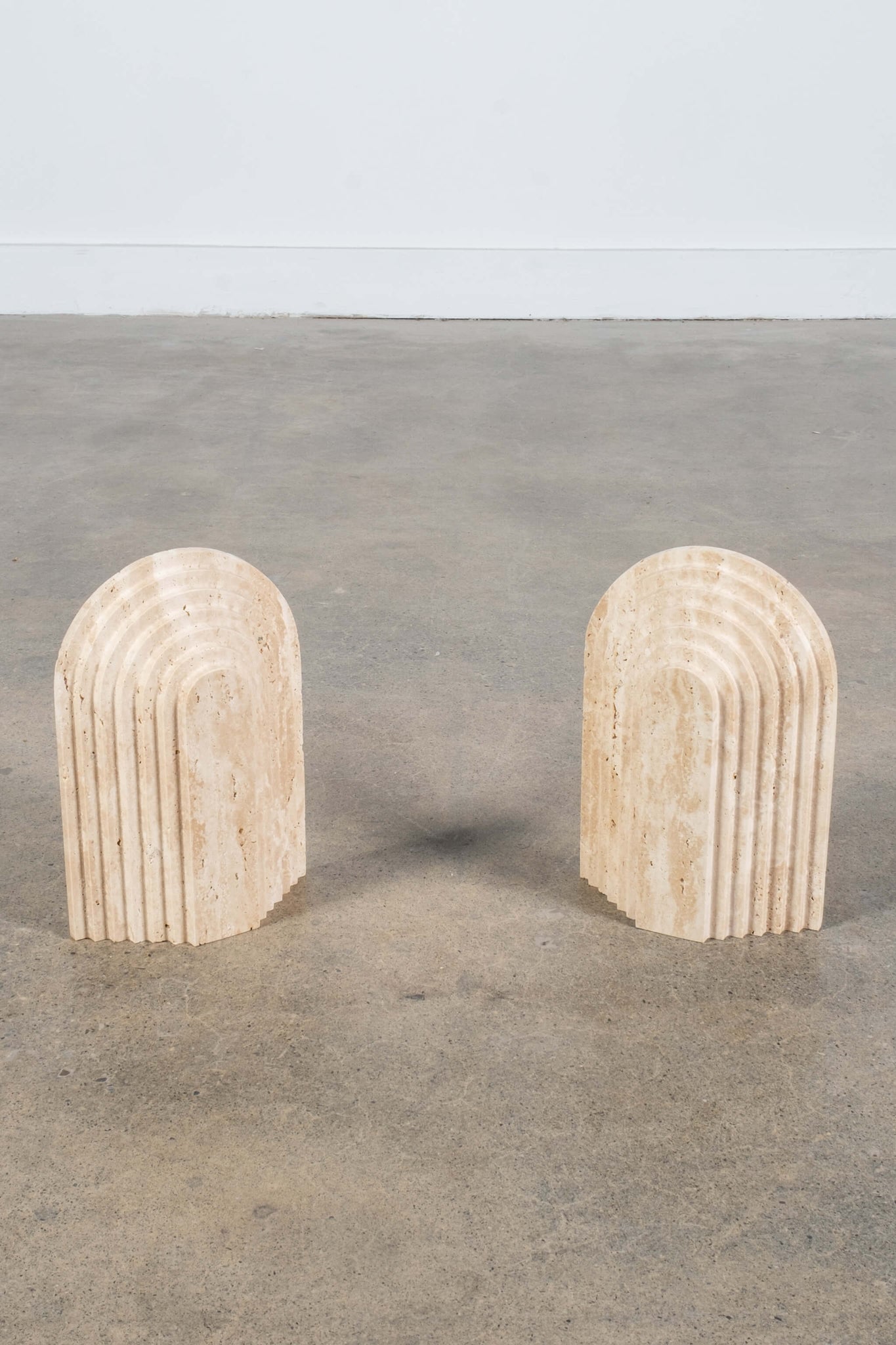 Pair of Arched Bookends in Travertine, front view