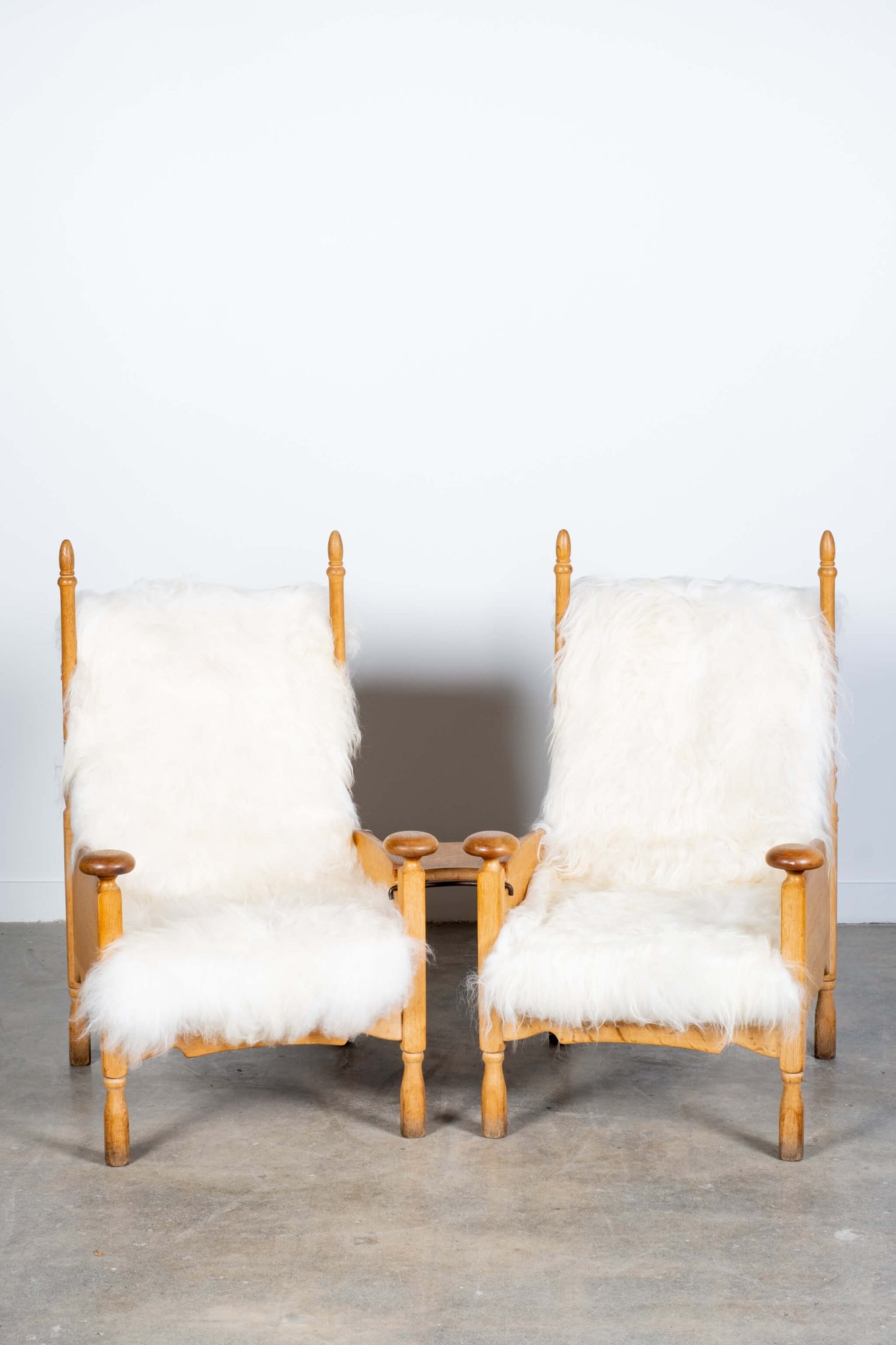 Pair of Vintage Throne Chairs in Longhaired Icelandic Sheepskin with Floating Side Table, front view