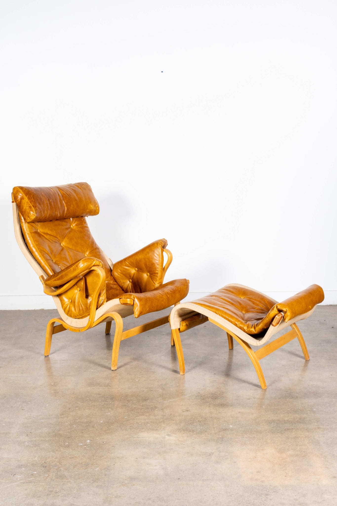 Pernilla 69 Leather and Beech Lounge Chair and Ottoman, angled view
