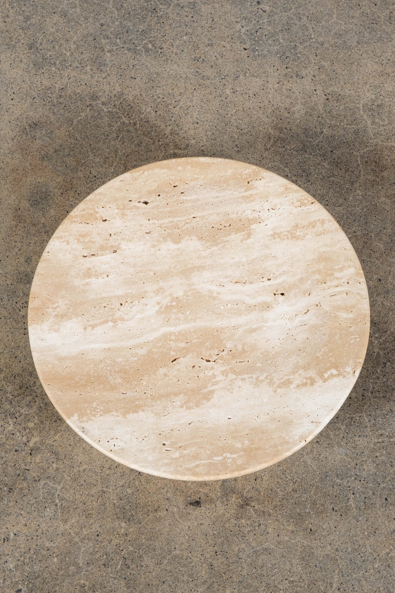 Round Footed Plate in Travertine, top view