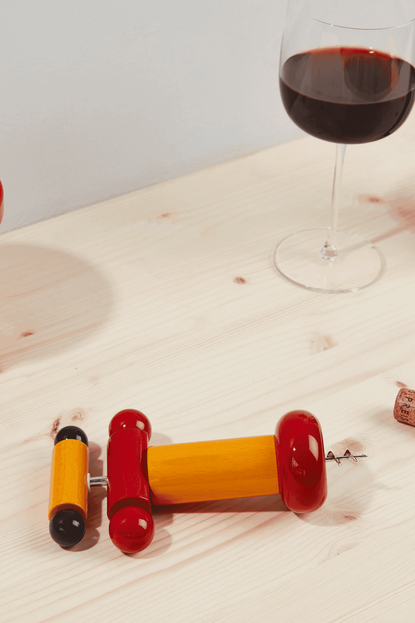 Corkscrew, Yellow Alessi Ettore Sottsass, shown on table